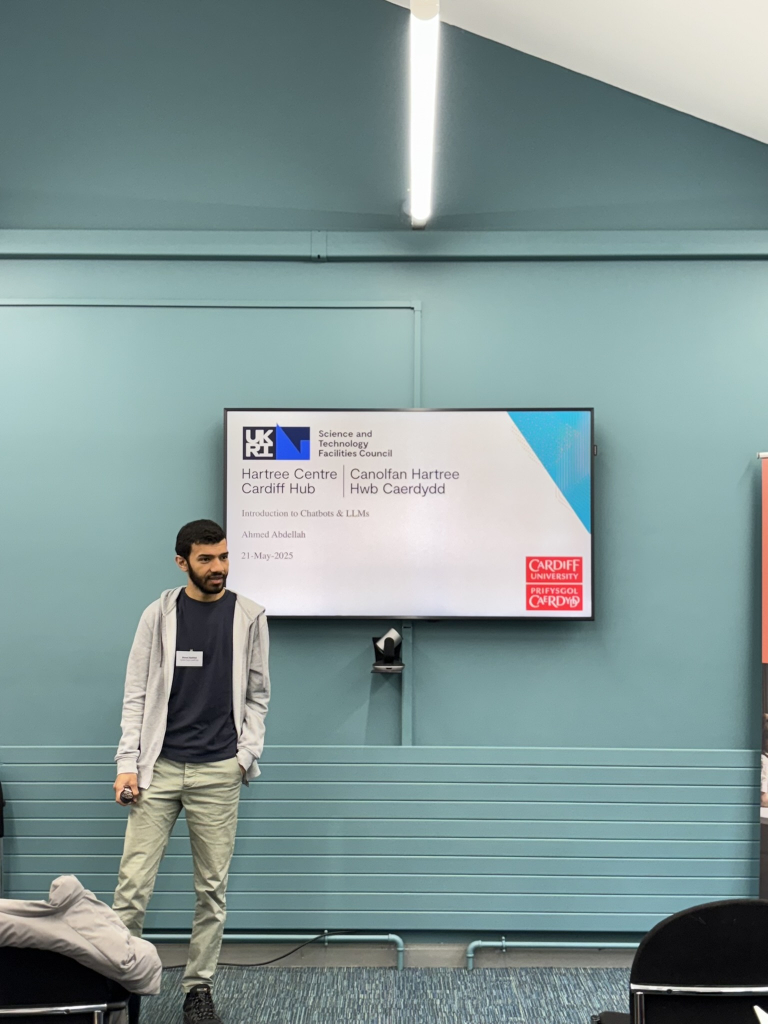 Ahmed at MediWales MedTech event with Introduction to Chatbots and LLMs slide