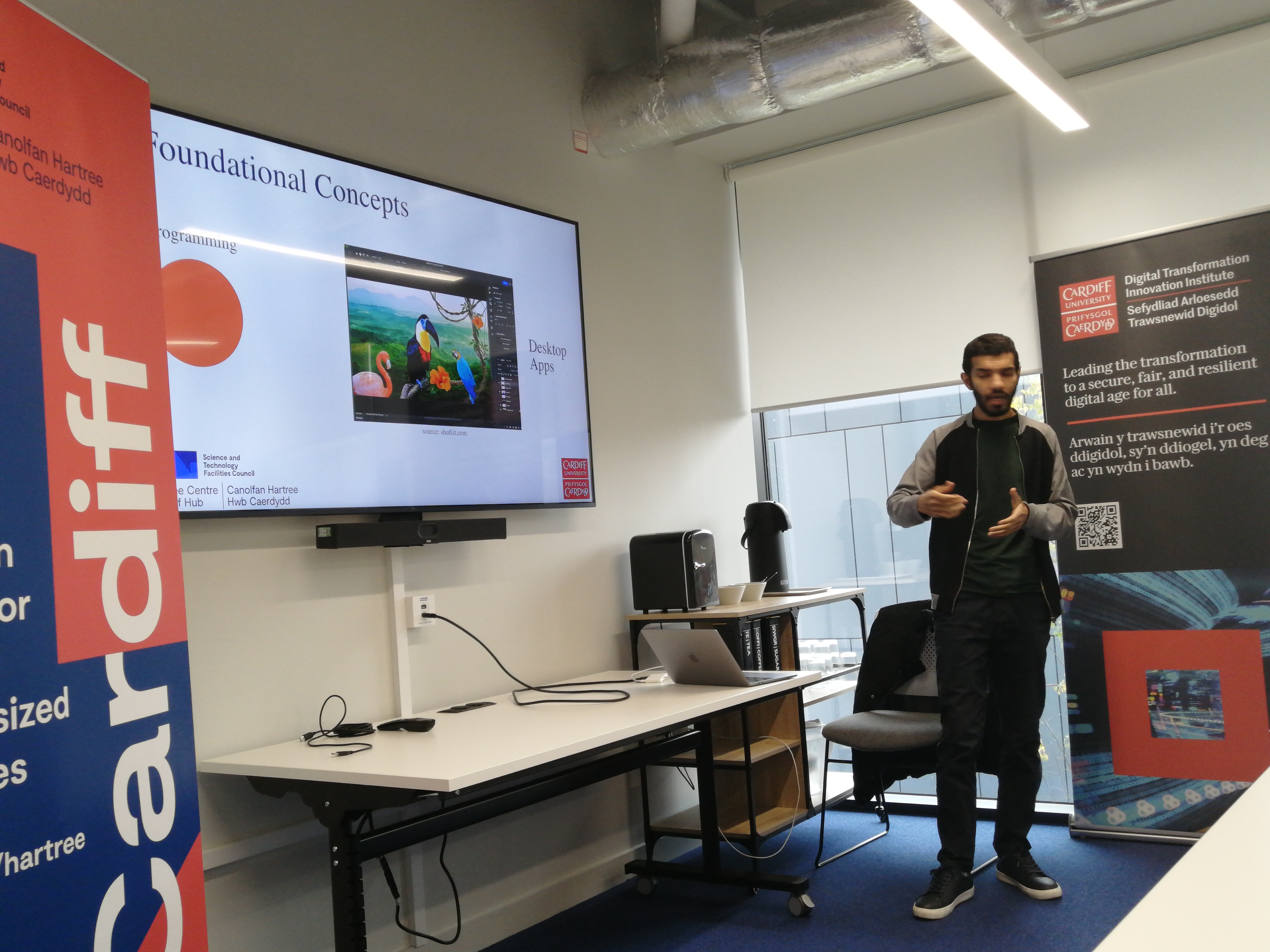 Ahmed presenting at Tech Valleys Ebbw Vale with Cardiff University branding