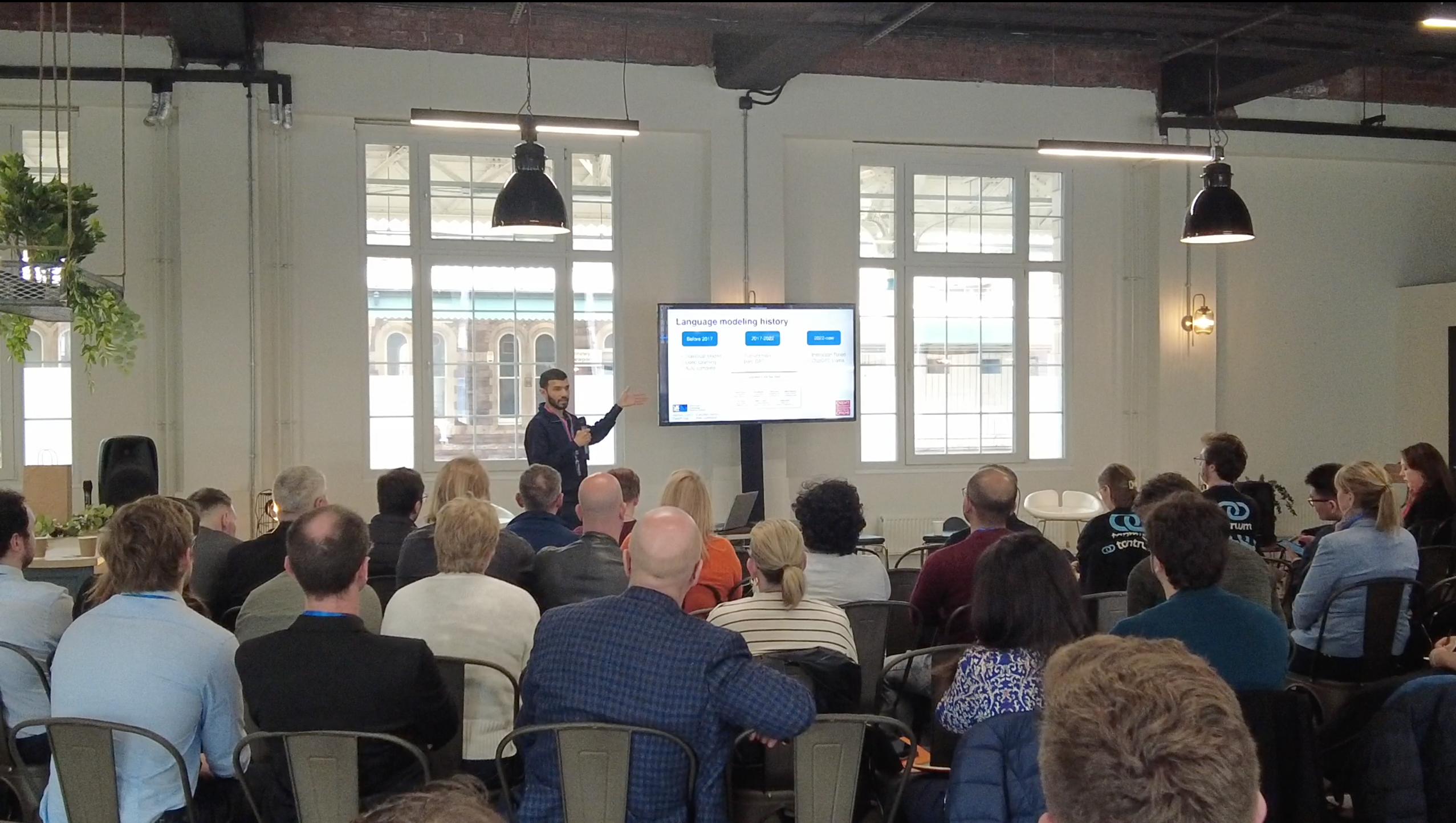 Ahmed presenting to a full audience at Tramshed Tech Newport